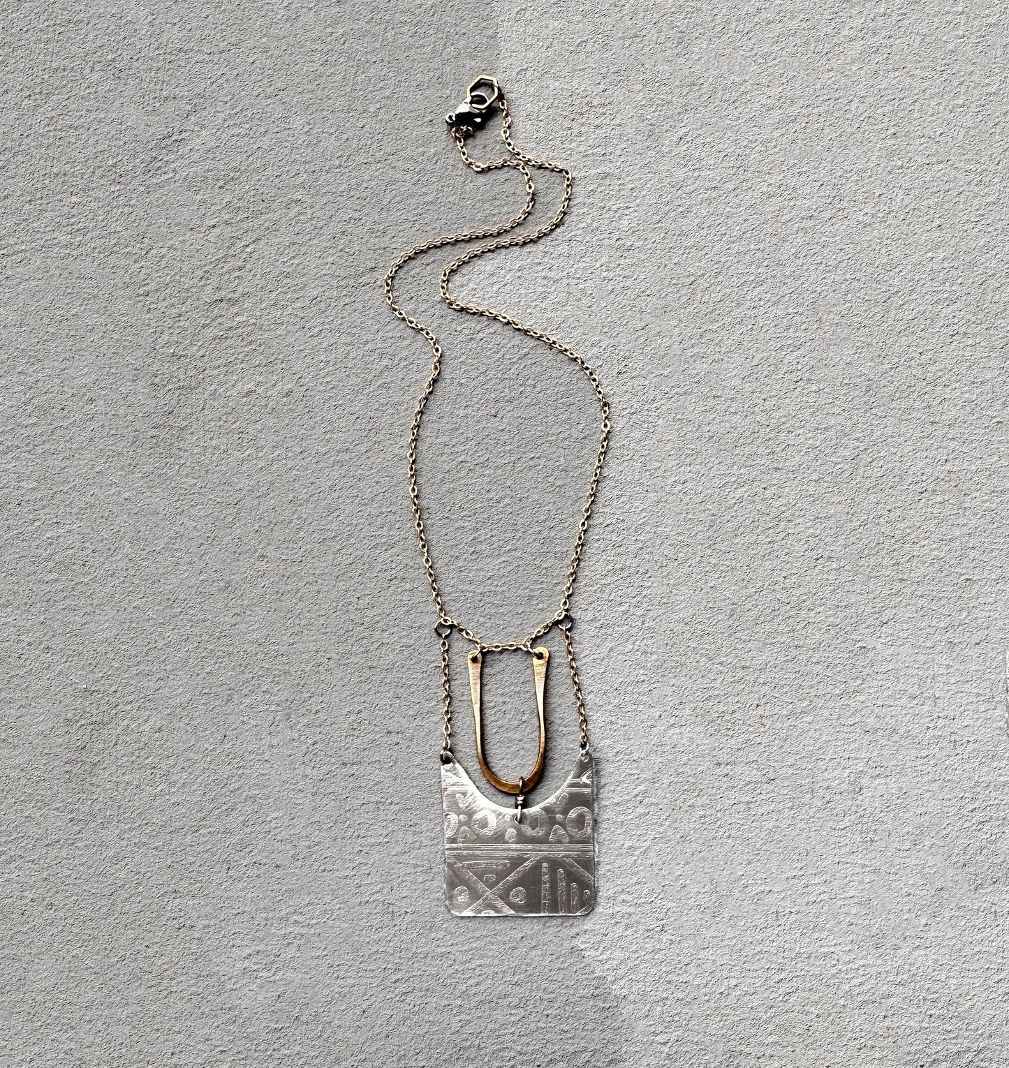 SILVER TRIBAL ETCHED SHIELD NECKLACE